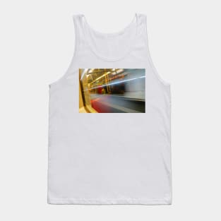 Commuters or passengers blurred in motion through window of passing train Tank Top